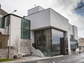 Modern courthouse building with large glass windows
